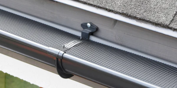 Gutter guard installation showing debris protection for local gutter replacement